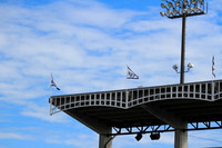 Stadium lights on a blue sky