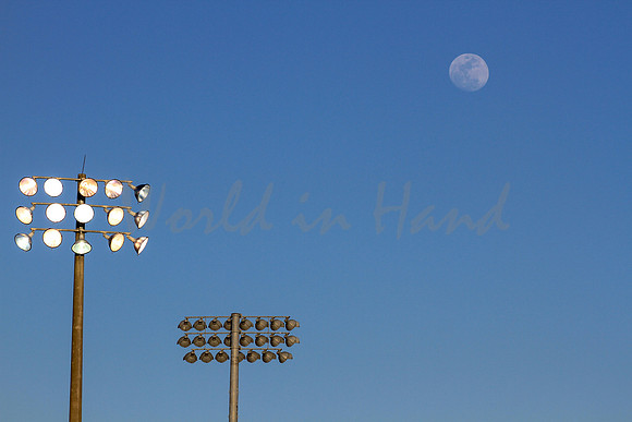 Stadium lights on a blue sky