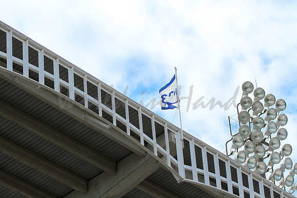 Stadium lights on a blue sky