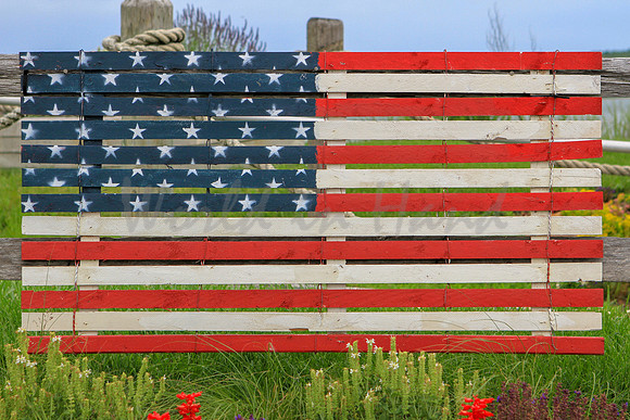 Rustic American flag on a fence
